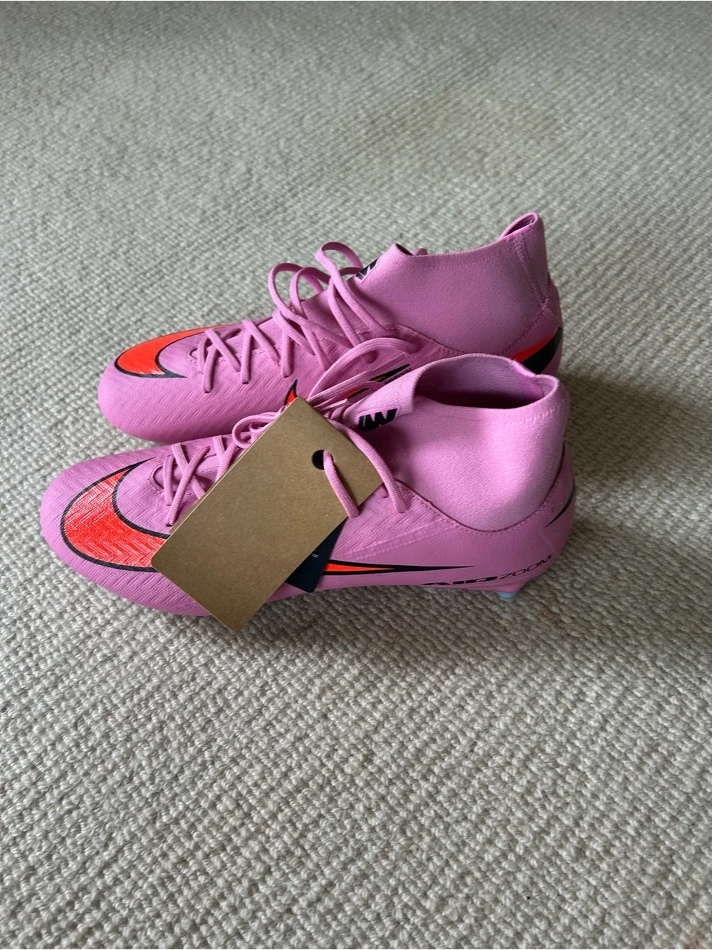 Nike Women’s Pink Sneakers with Orange Swoosh